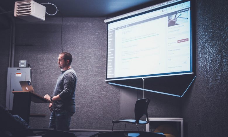 person standing in front of brown lectern