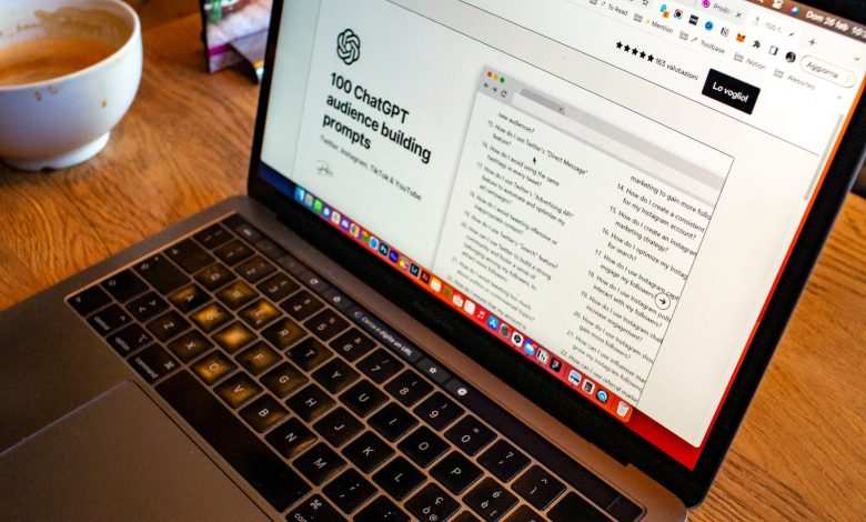 a laptop computer sitting on top of a wooden table