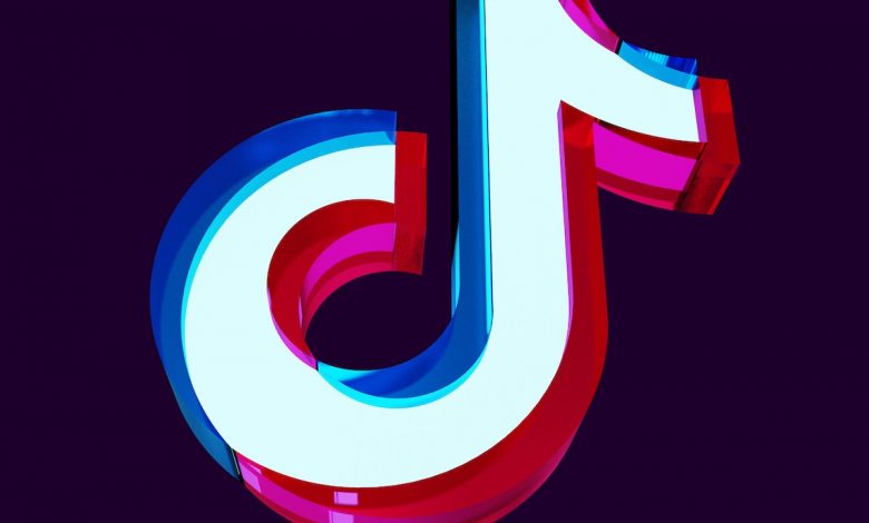 a red, white, and blue logo on a black background