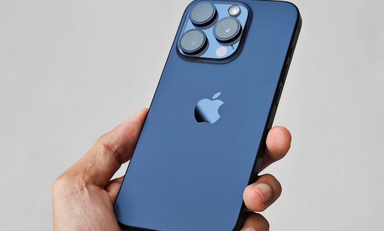 a person holding an iphone in their hand