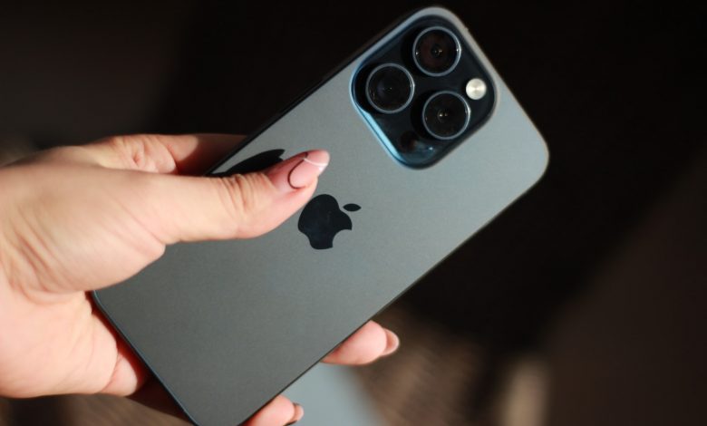 a person holding an iphone in their hand