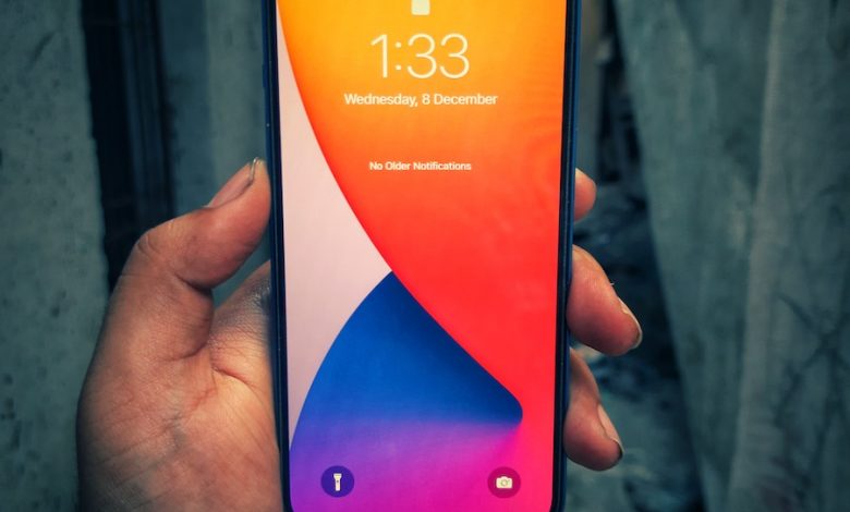 a person holding an iphone in their hand