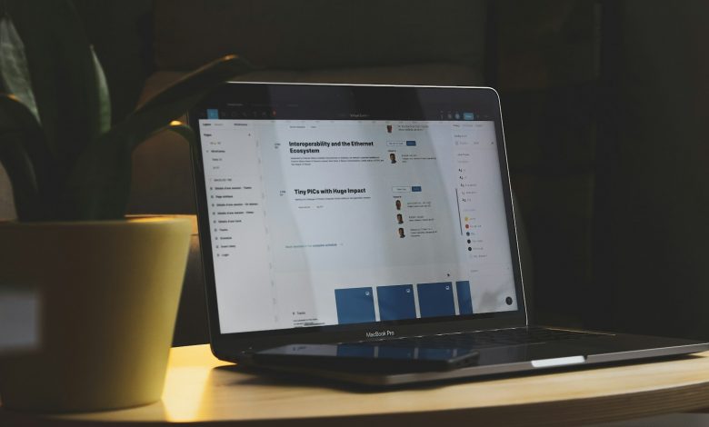 black tablet computer on brown wooden table