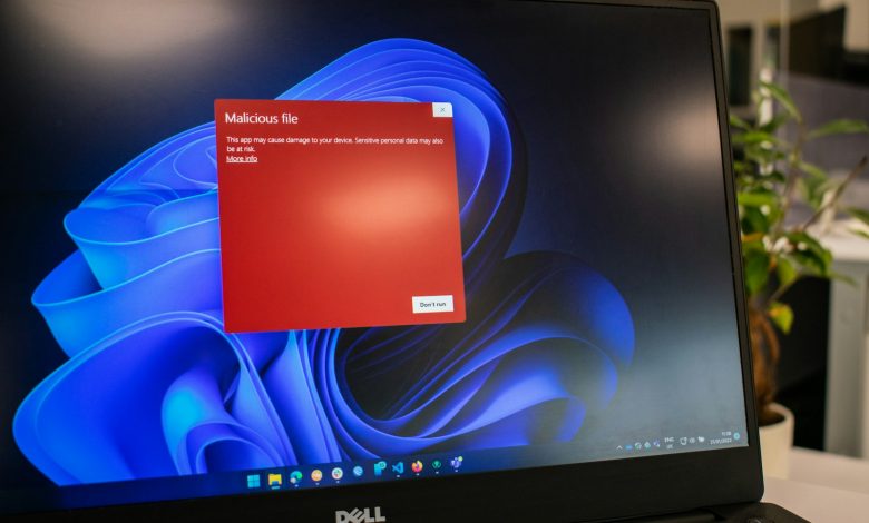 a dell laptop computer with a red screen